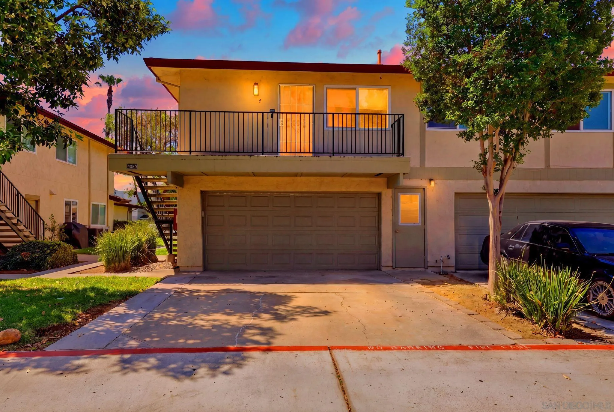 9926 Mission Vega Road, Unit 4 Santee, CA 92071 - Photo 2 of 30 a view of a house with a patio and a garage
