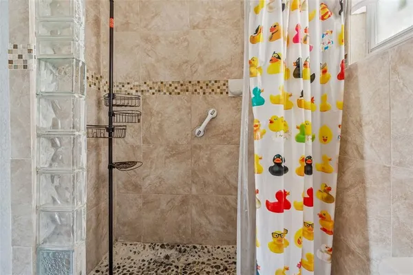 a bathroom with a shower curtain