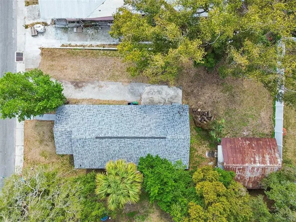 an aerial view of a houses with outdoor space