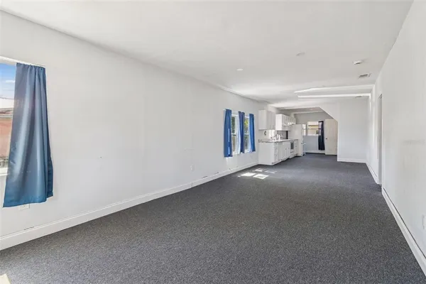 a view of empty room with floor to ceiling window