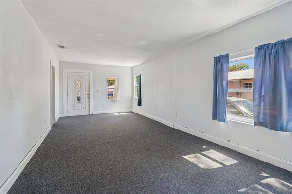 an empty room with windows