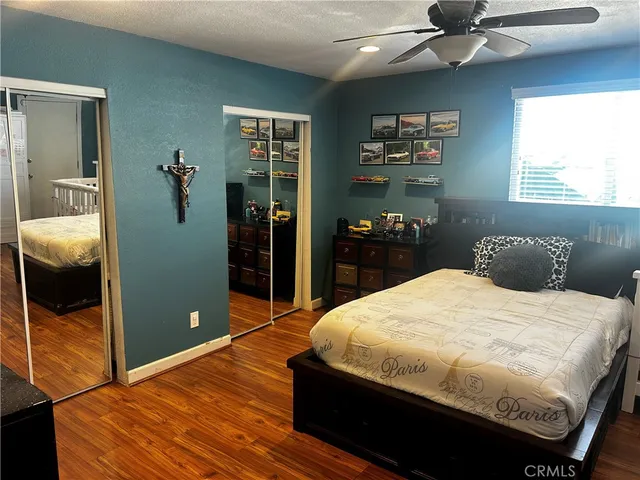 a bedroom with a bed and a walk in closet