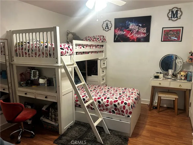 a bedroom with furniture and a fireplace