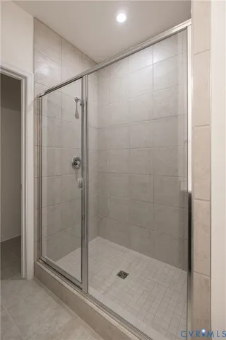 a bathroom with a shower and a sink