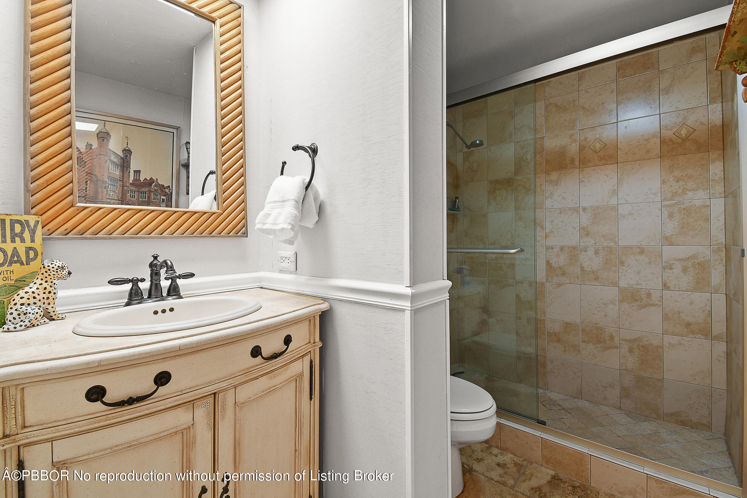 2170 Ibis Isle Road, Unit 2 Palm Beach, FL 33480 - Photo 19 of 38 a bathroom with a sink mirror vanity and toilet