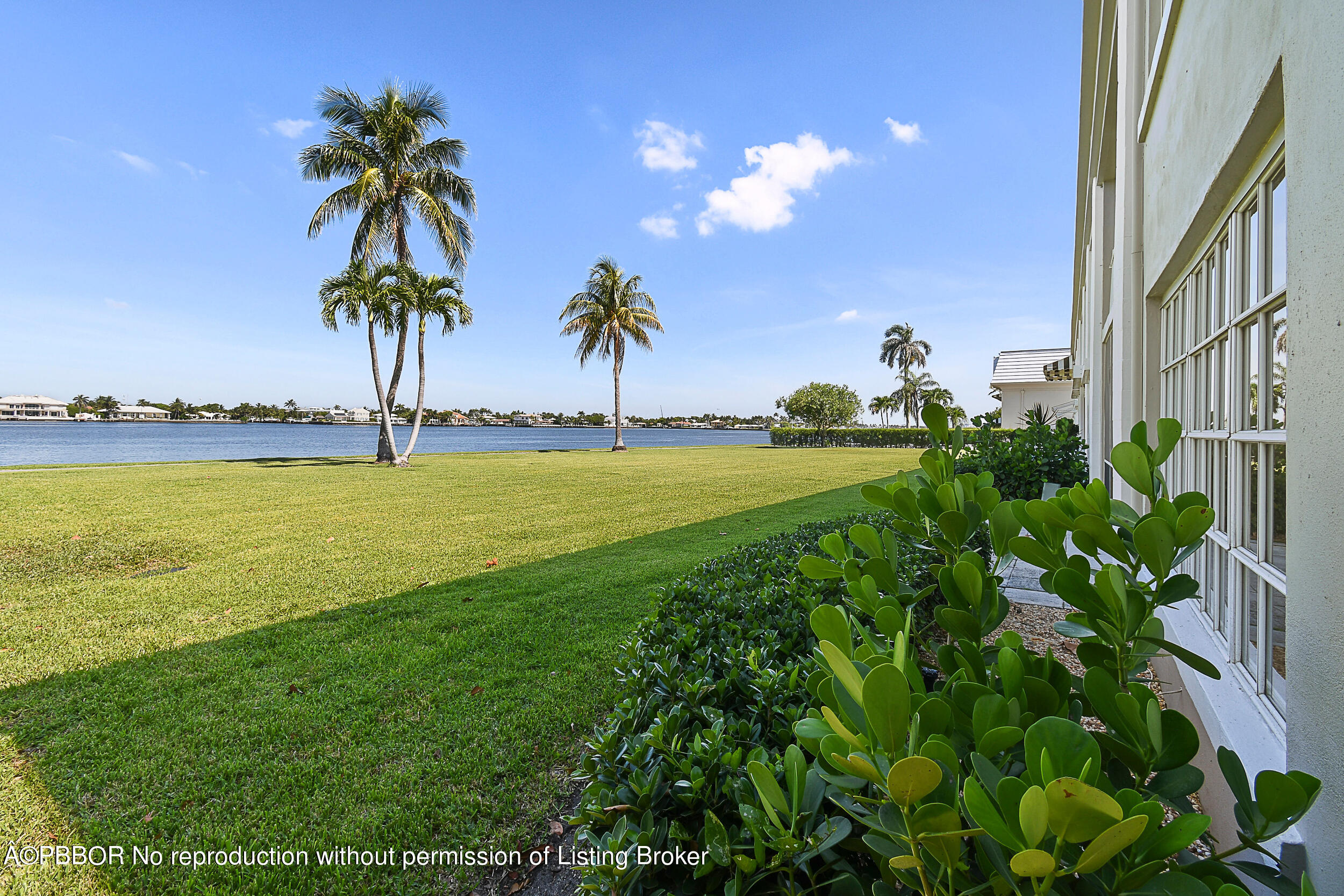 2170 Ibis Isle Road, Unit 2 Palm Beach, FL 33480 - Photo 23 of 38 a view of a swimming pool and a yard