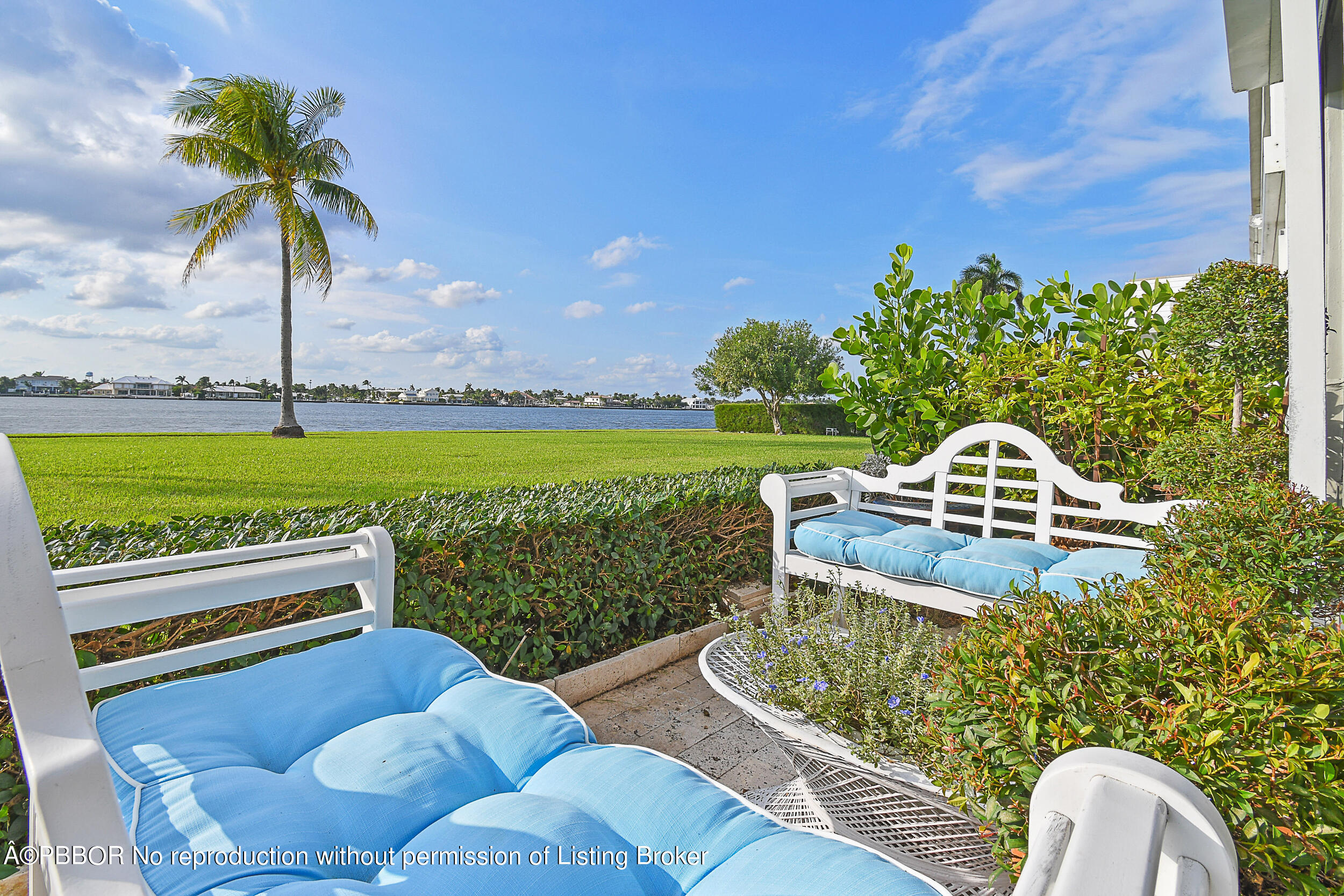 2170 Ibis Isle Road, Unit 2 Palm Beach, FL 33480 - Photo 34 of 38 a front view of a house with a garden and outdoor seating