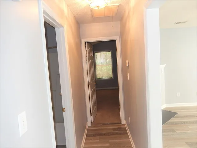 a view of a bathroom from a hallway