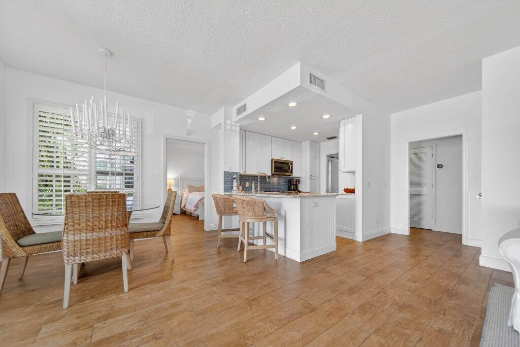 391 Northeast Plantation Road, Unit 215 Jensen Beach, FL 34957 - Photo 4 of 20 kitchendining1.jpg-SMALL