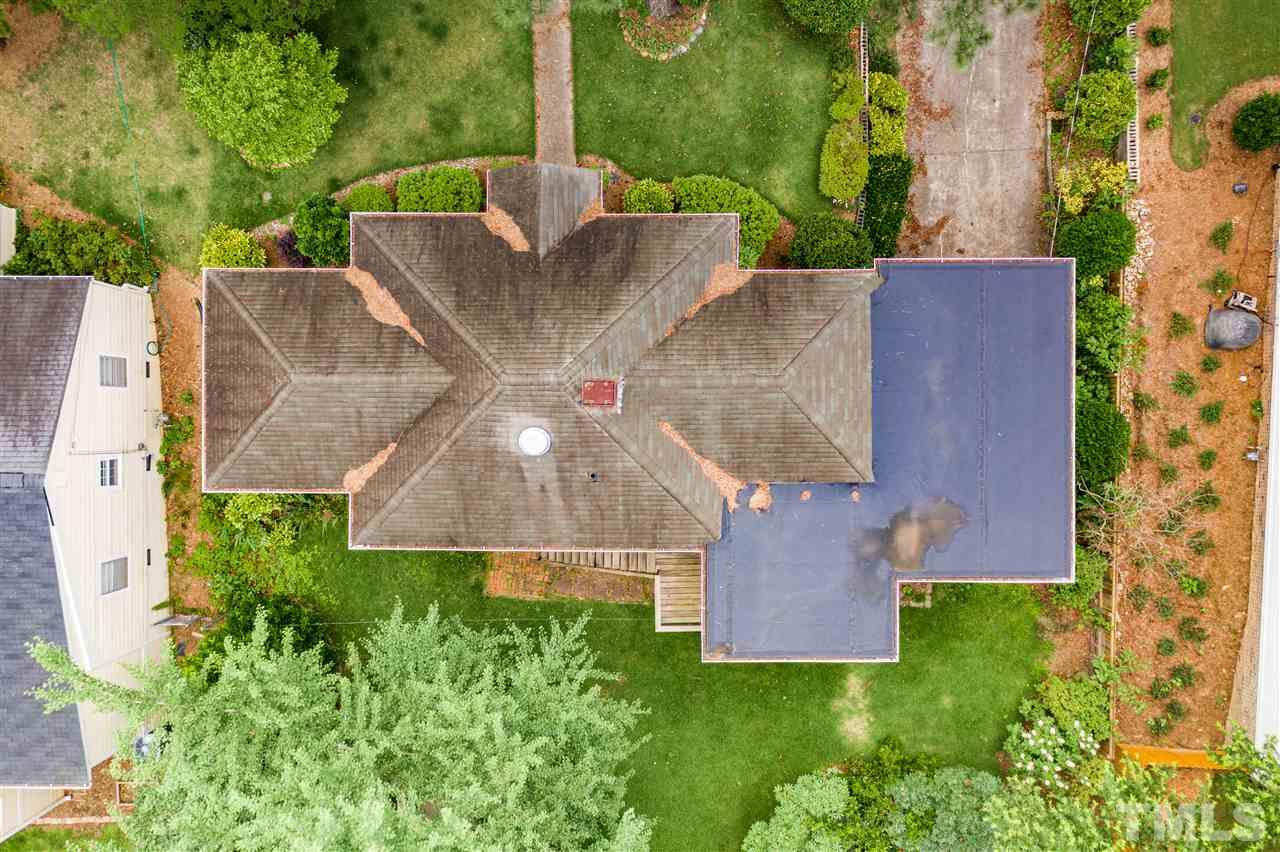 925 Marilyn Drive Raleigh, NC 27607 - Photo 12 of 13 an aerial view of a house with garden space and street view