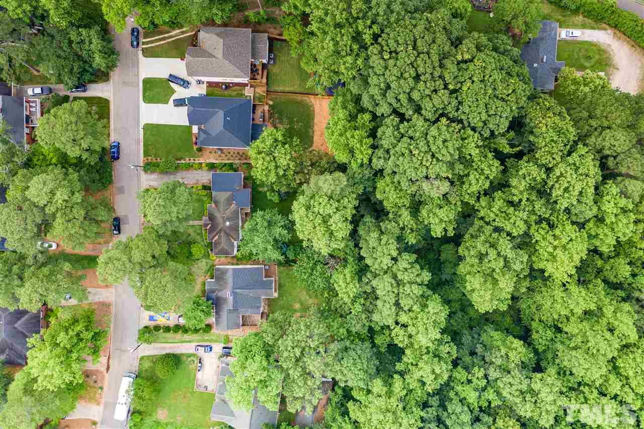 925 Marilyn Drive Raleigh, NC 27607 - Photo 3 of 13 an aerial view of residential house with outdoor space and trees all around