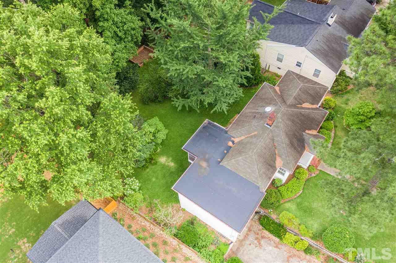 925 Marilyn Drive Raleigh, NC 27607 - Photo 5 of 13 an aerial view of a house with a yard and a large tree