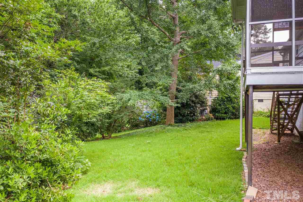 925 Marilyn Drive Raleigh, NC 27607 - Photo 9 of 13 a view of a yard with a tree