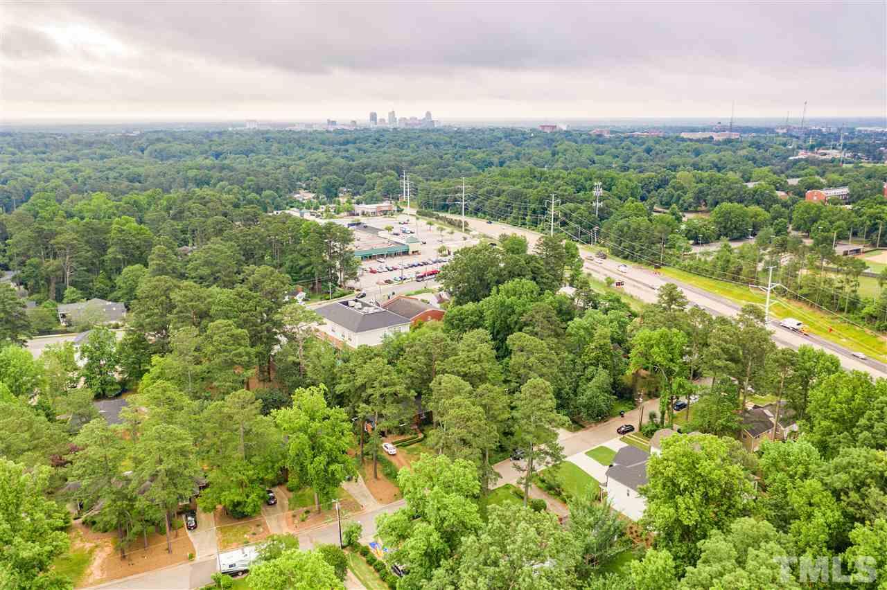 925 Marilyn Drive Raleigh, NC 27607 - Photo 10 of 13 a view of a city with lush green forest
