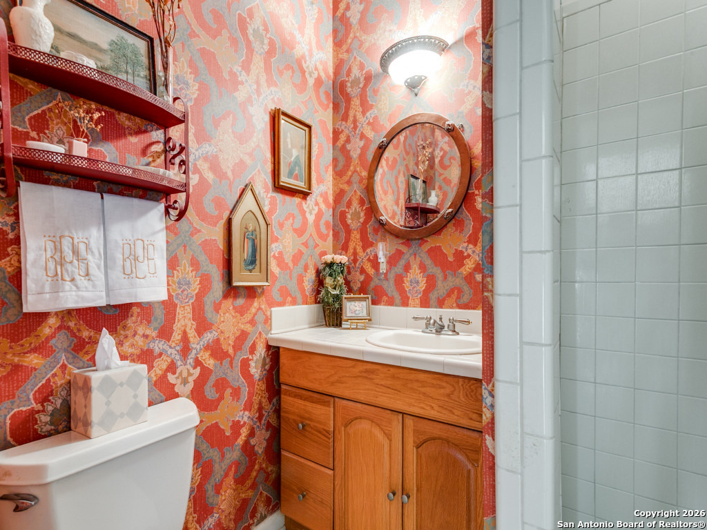 316 Elizabeth Road Terrell Hills, TX 78209 - Photo 17 of 25 a bathroom with a sink and a mirror