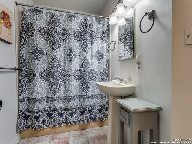 a bathroom with a sink and mirror