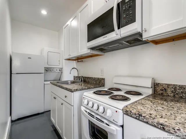 a kitchen with a stove and a microwave