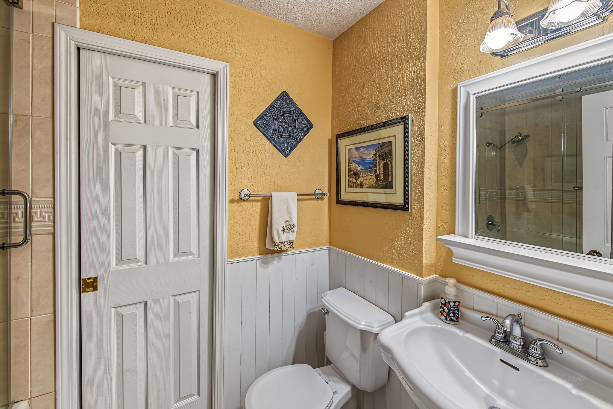3013 Teague Road Houston, TX 77080 - Photo 29 of 37 Upstairs hall bath has updated tile in the tub/shower area, sliding glass doors and ample linen storage.