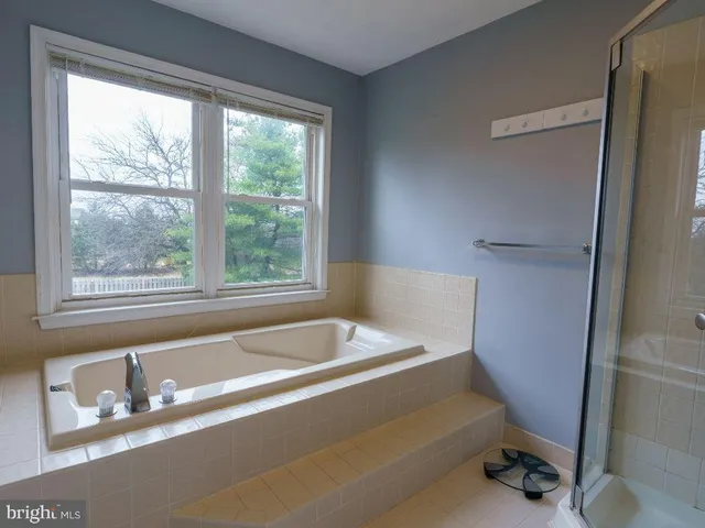 a bathroom with a tub and a sink