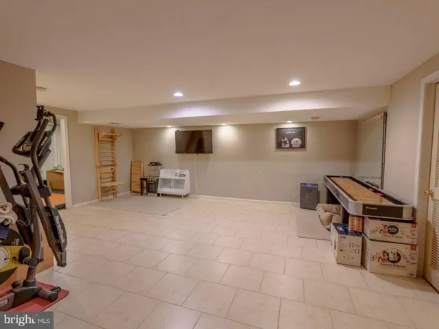 a view of a livingroom with furniture and a workspace