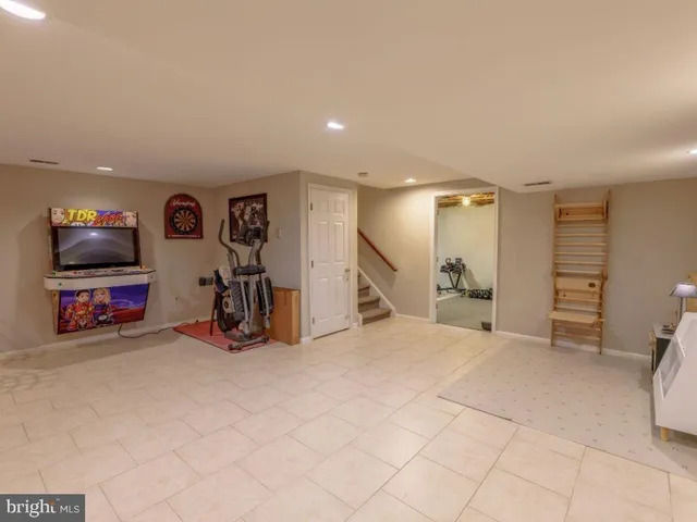 a view of a livingroom with furniture and a flat screen tv