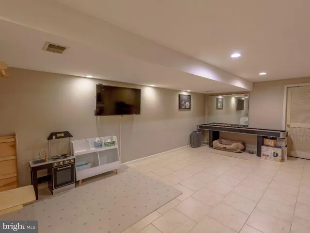 a room with furniture and a flat screen tv