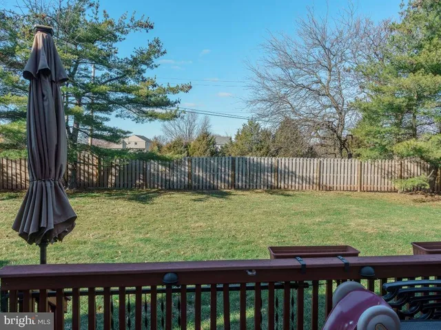 a view of a wooden deck with back yard