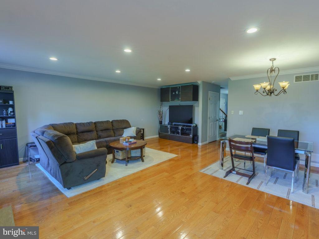 2014 Ryans Run Lansdale, PA 19446 - Photo 9 of 36 a living room with furniture a dining table and a fireplace