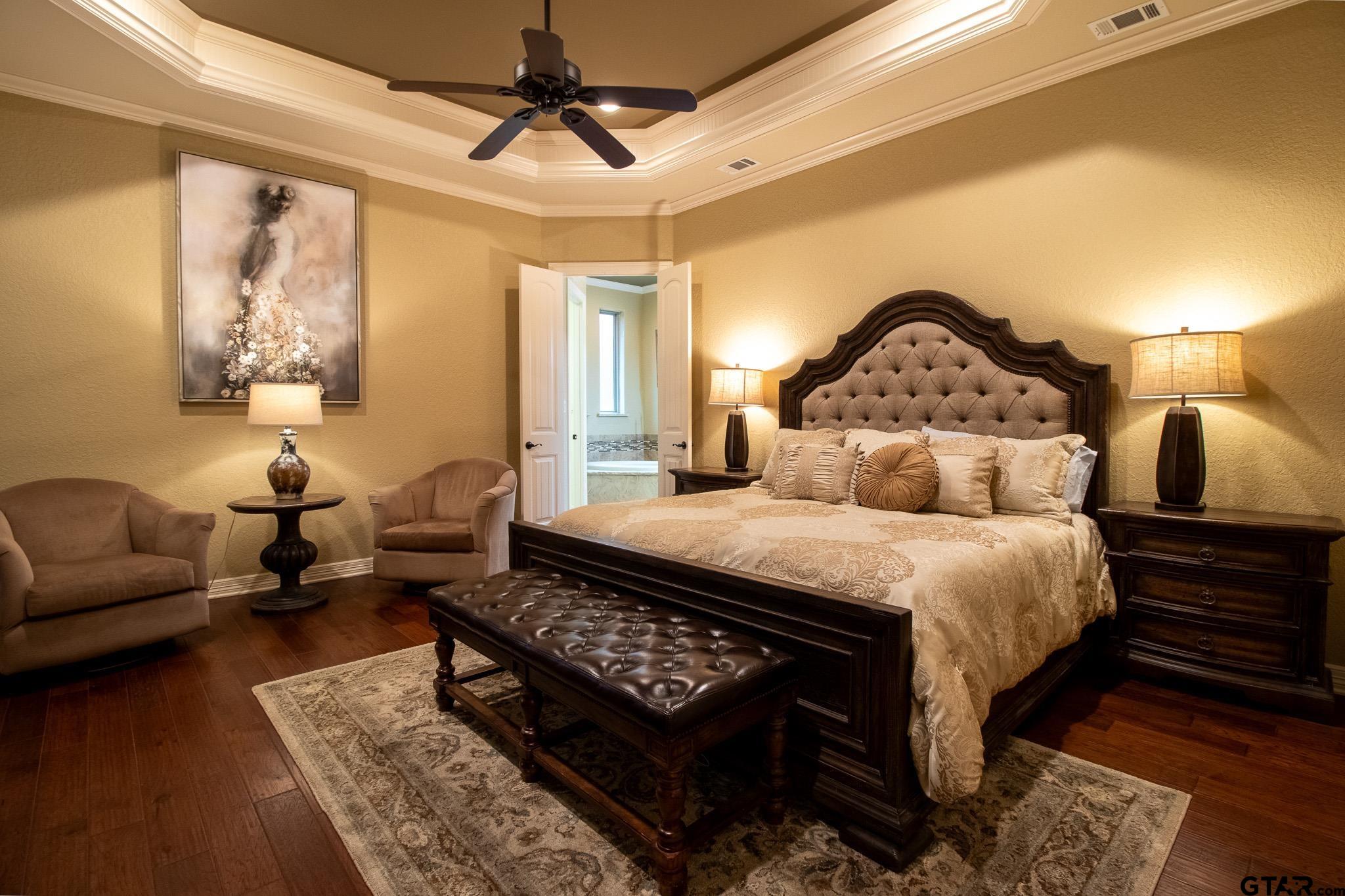 7315 Princedale Tyler, TX 75703 - Photo 11 of 25 a bedroom with a bed a couch and a potted plant on the dresser