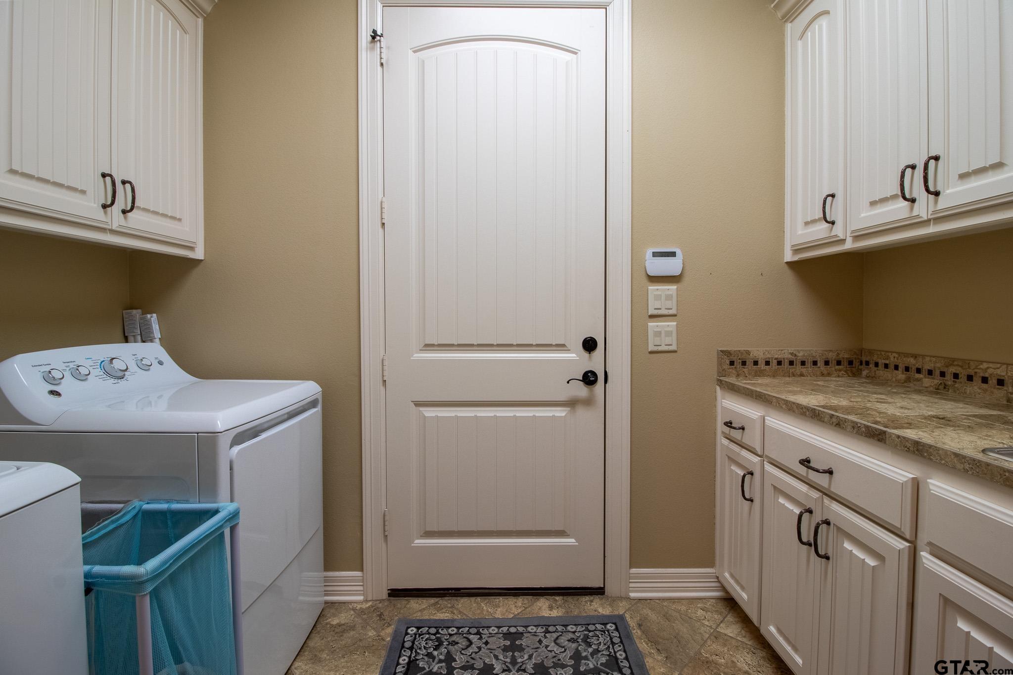 7315 Princedale Tyler, TX 75703 - Photo 18 of 25 a utility room with dryer and washer