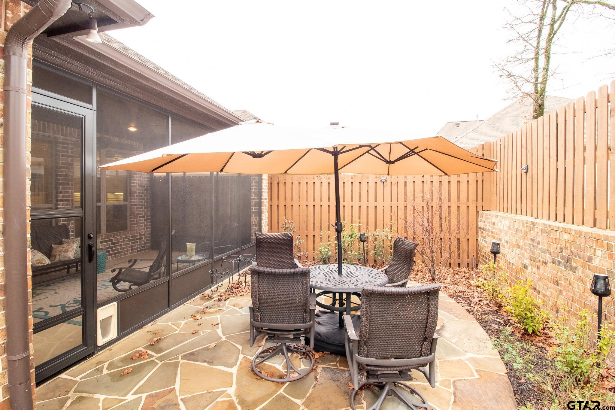 7315 Princedale Tyler, TX 75703 - Photo 25 of 25 a view of a patio with a table and chairs