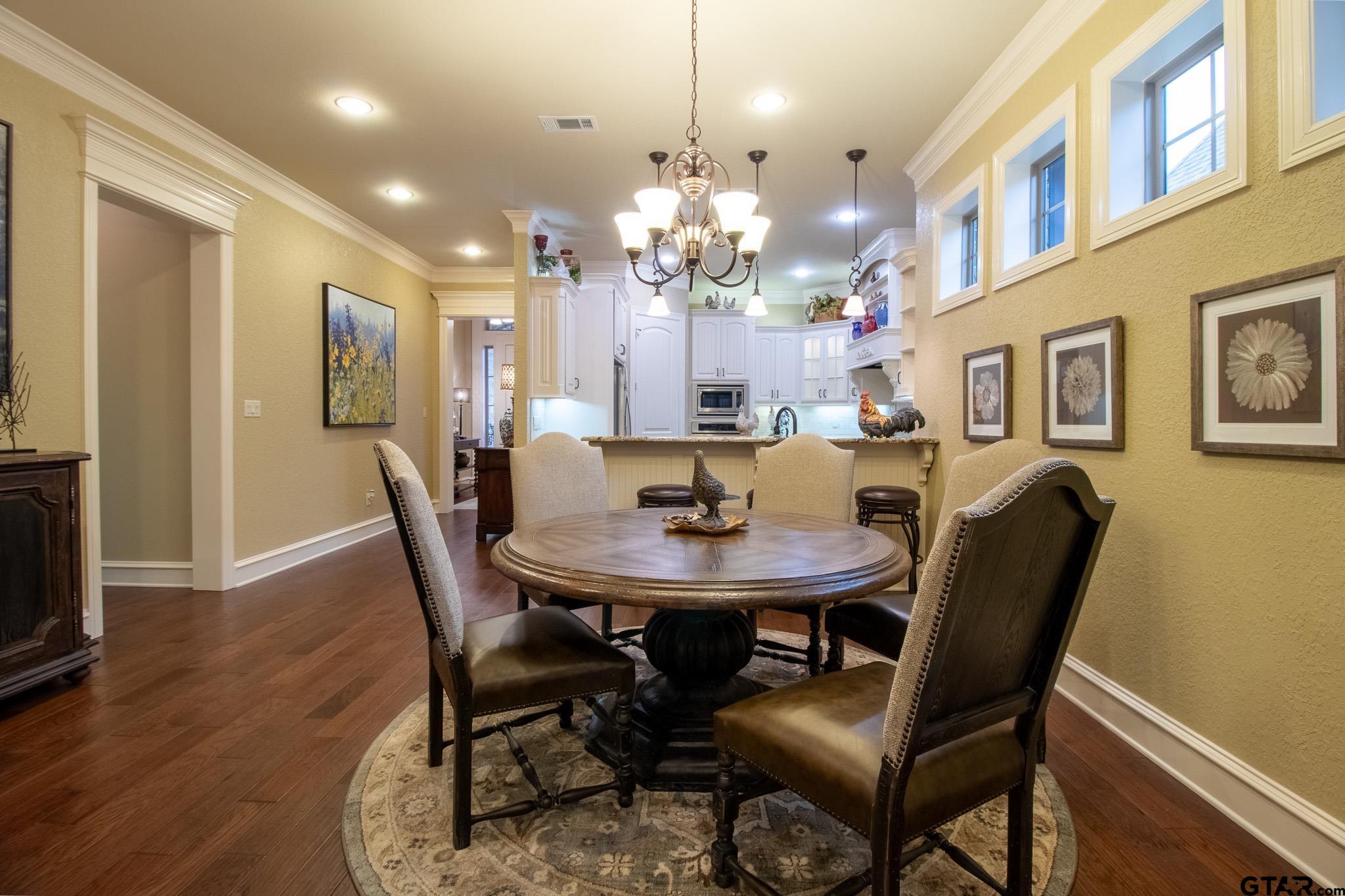 7315 Princedale Tyler, TX 75703 - Photo 9 of 25 a view of a dining room with furniture and wooden floor