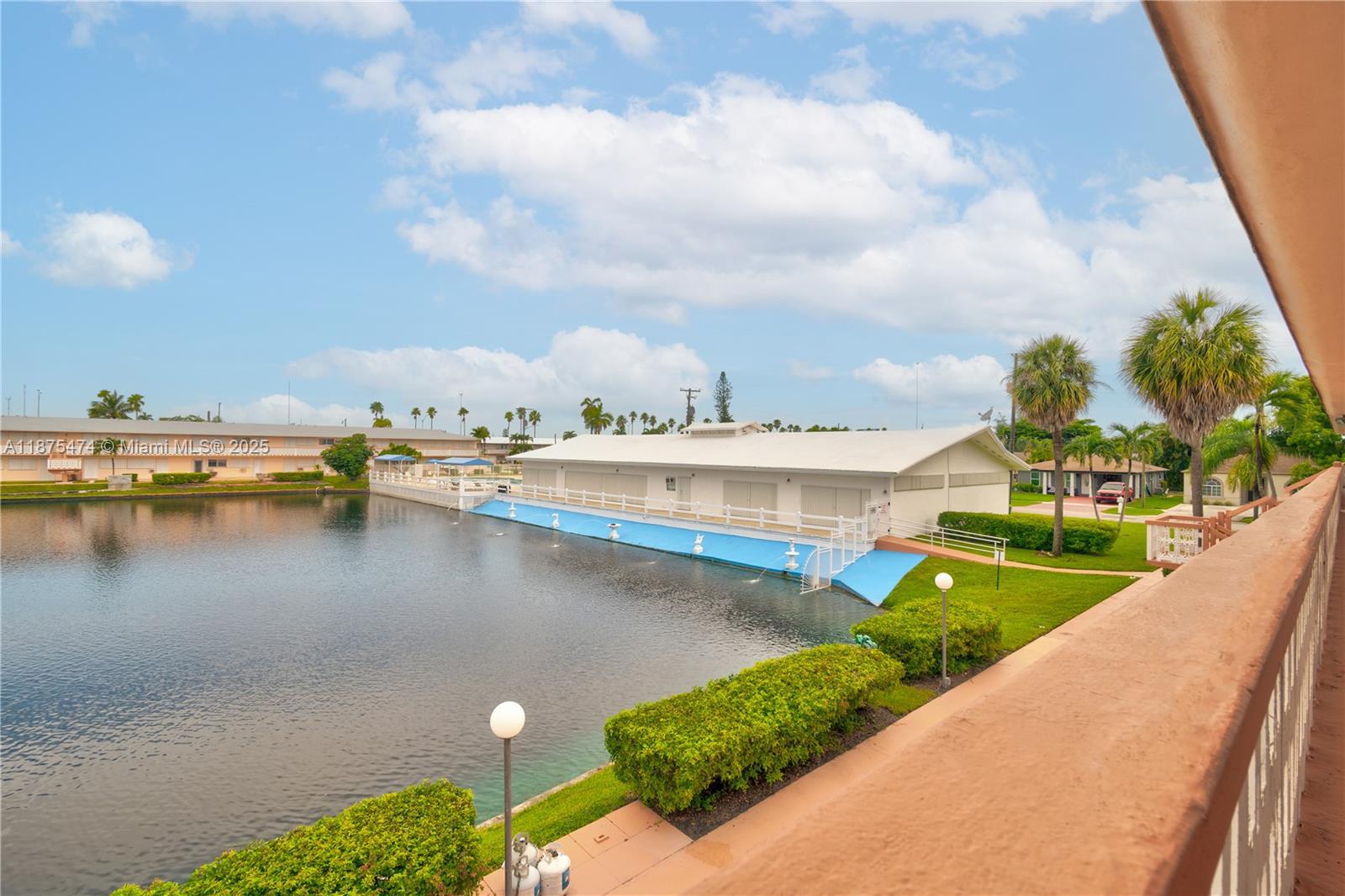 800 Southwest 10th Terrace, Unit 20T Hallandale Beach, FL 33009 - Photo 18 of 28 a view of a lake with a house