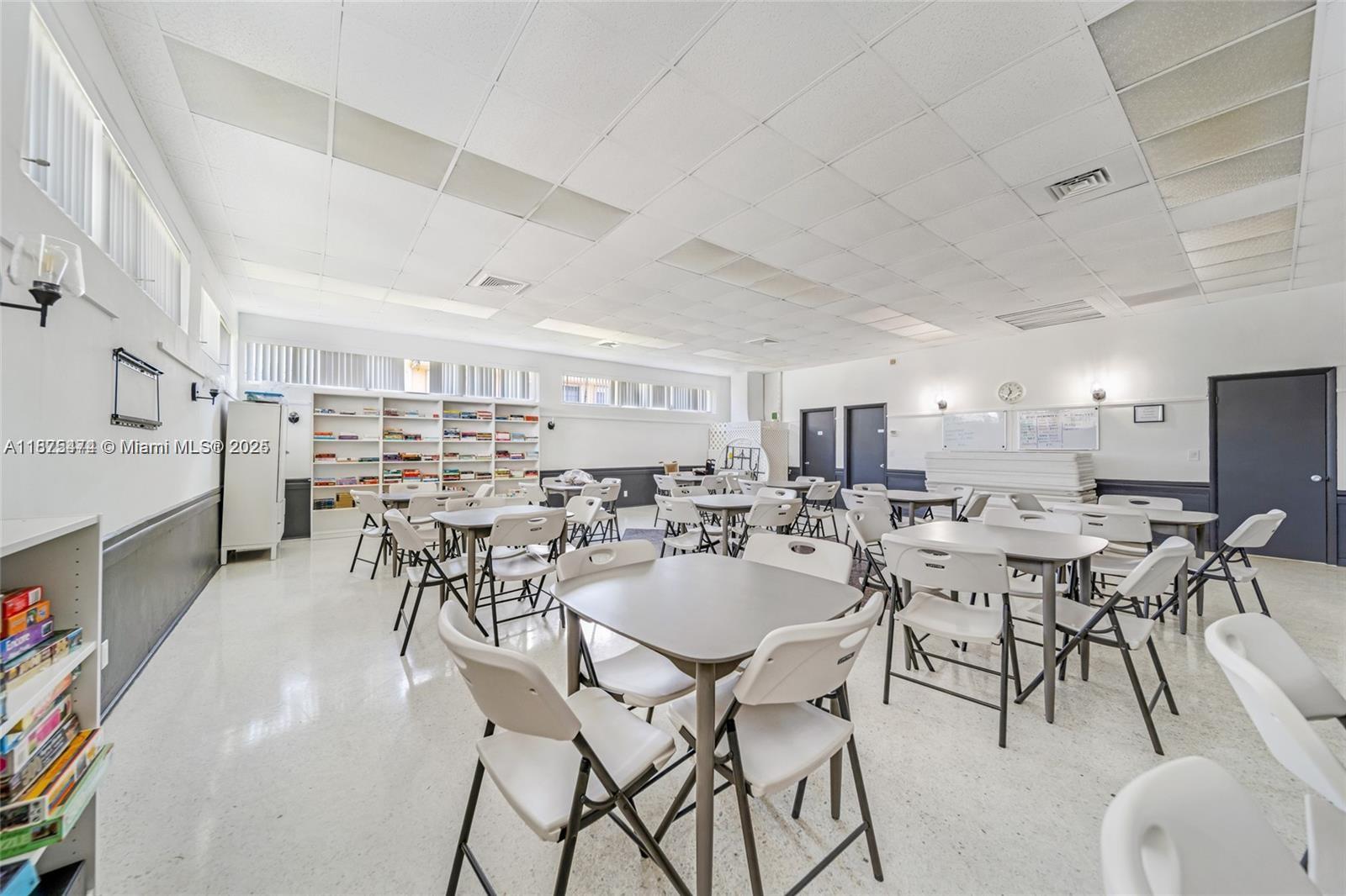 800 Southwest 10th Terrace, Unit 20T Hallandale Beach, FL 33009 - Photo 27 of 28 a very nice looking open dining room with kitchen view and a fireplace