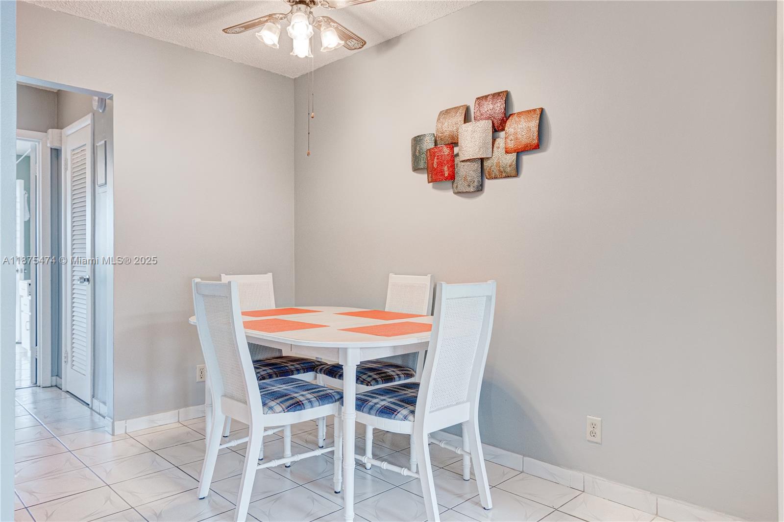 800 Southwest 10th Terrace, Unit 20T Hallandale Beach, FL 33009 - Photo 6 of 28 a dining room with a table and chairs