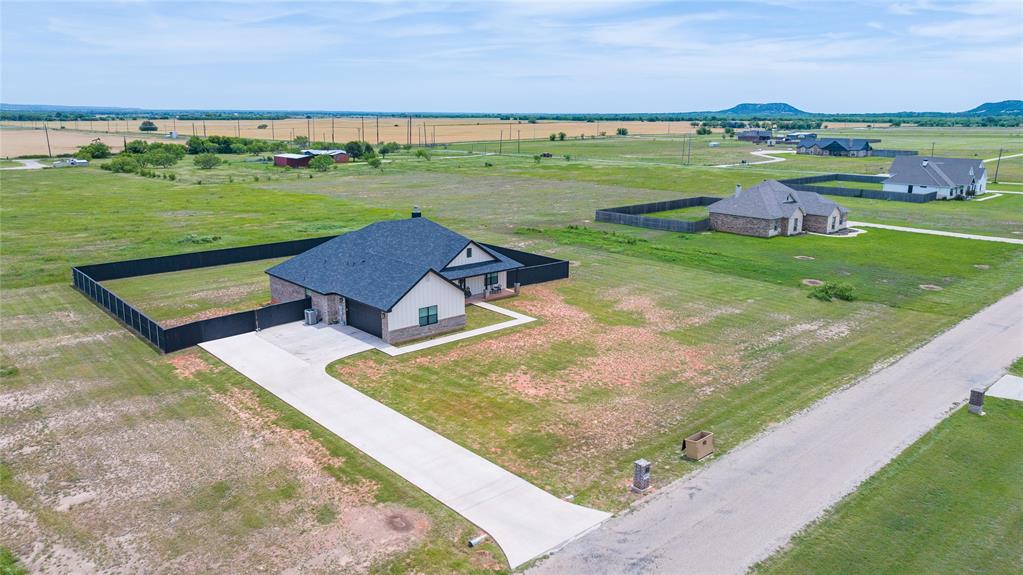 143 Purcell Lane Tuscola, TX 79562 - Photo 1 of 35 an aerial view of a house with a yard and lake view