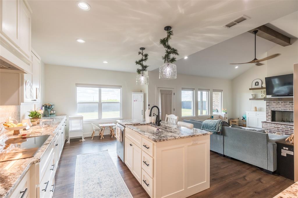 143 Purcell Lane Tuscola, TX 79562 - Photo 14 of 35 a large kitchen with kitchen island lots of counter space a sink appliances and a window