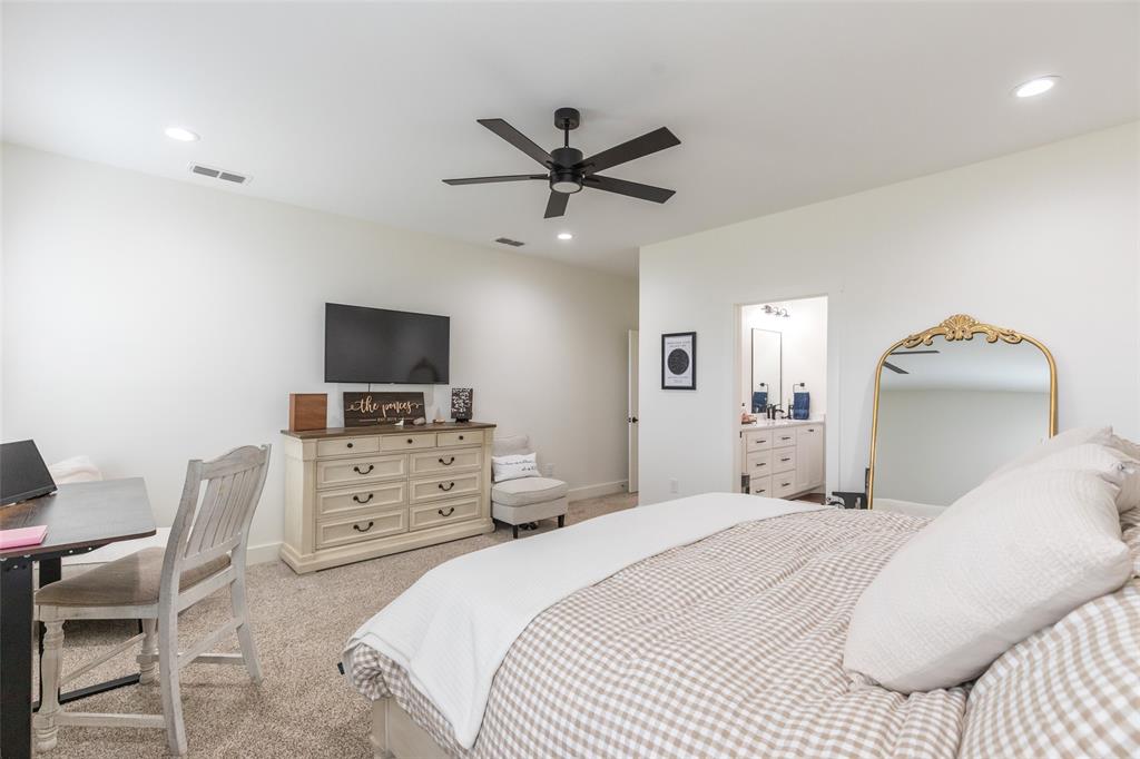 143 Purcell Lane Tuscola, TX 79562 - Photo 20 of 35 a bedroom with a bed and a flat screen tv