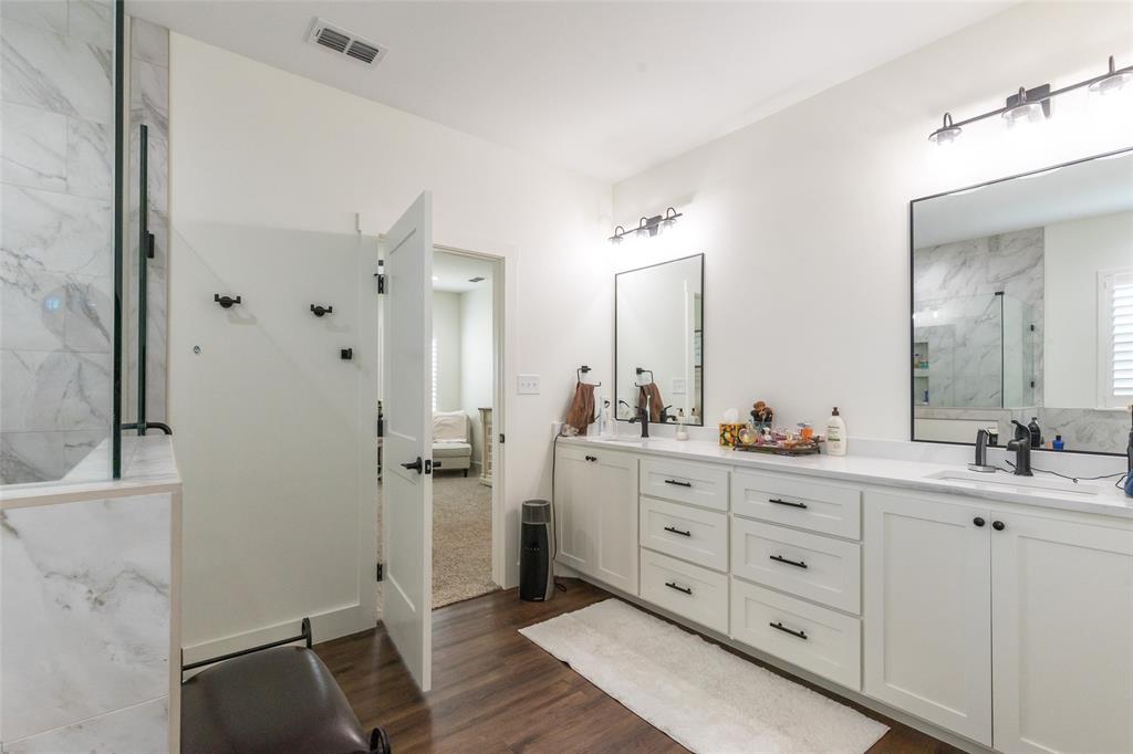 143 Purcell Lane Tuscola, TX 79562 - Photo 23 of 35 a bathroom with a double vanity sink mirror and shower