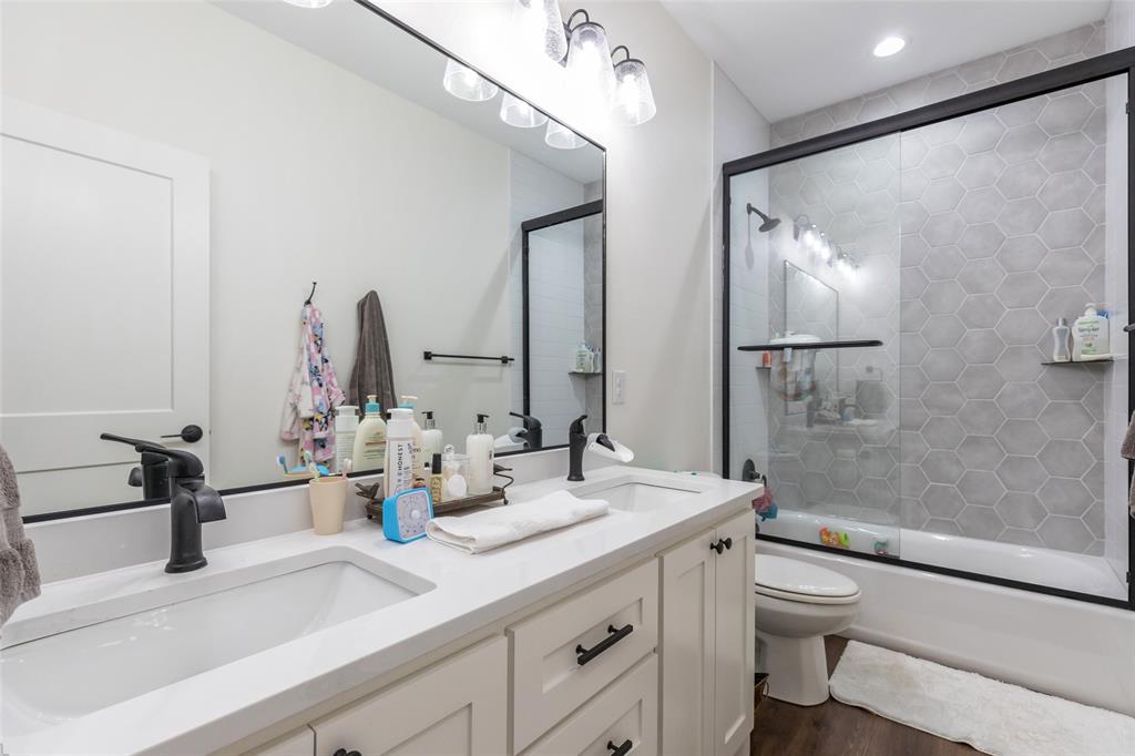 143 Purcell Lane Tuscola, TX 79562 - Photo 28 of 35 a bathroom with a double vanity sink toilet and shower