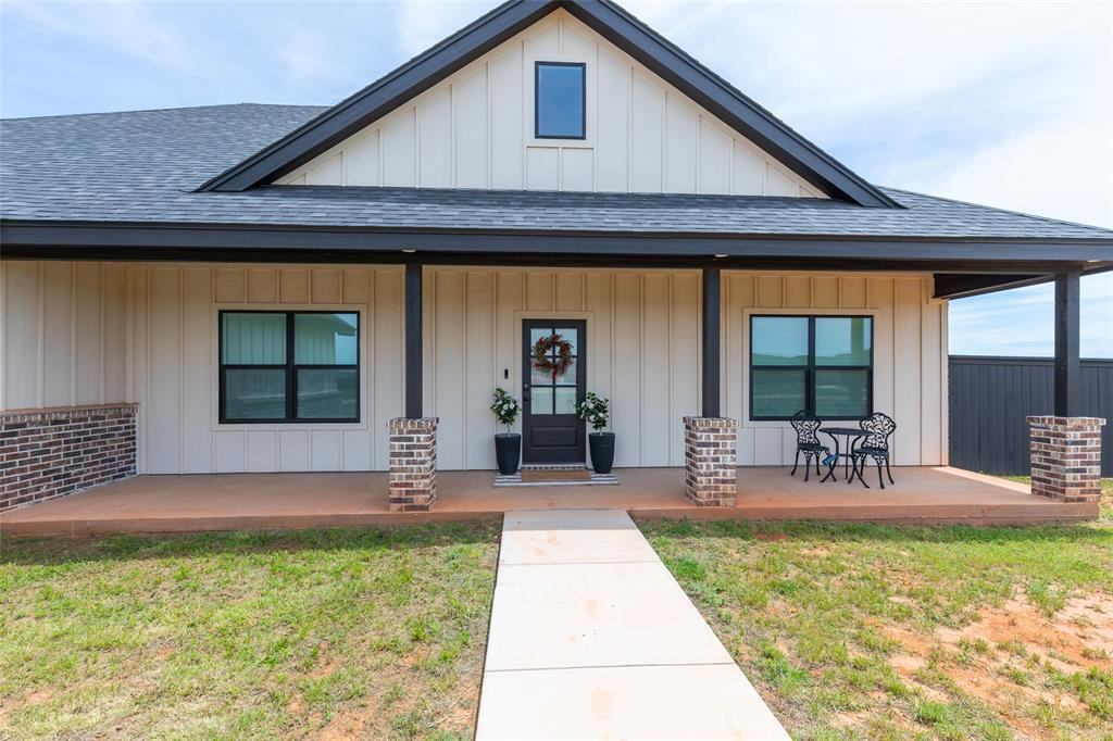 143 Purcell Lane Tuscola, TX 79562 - Photo 3 of 35 a front view of house with a garden and patio