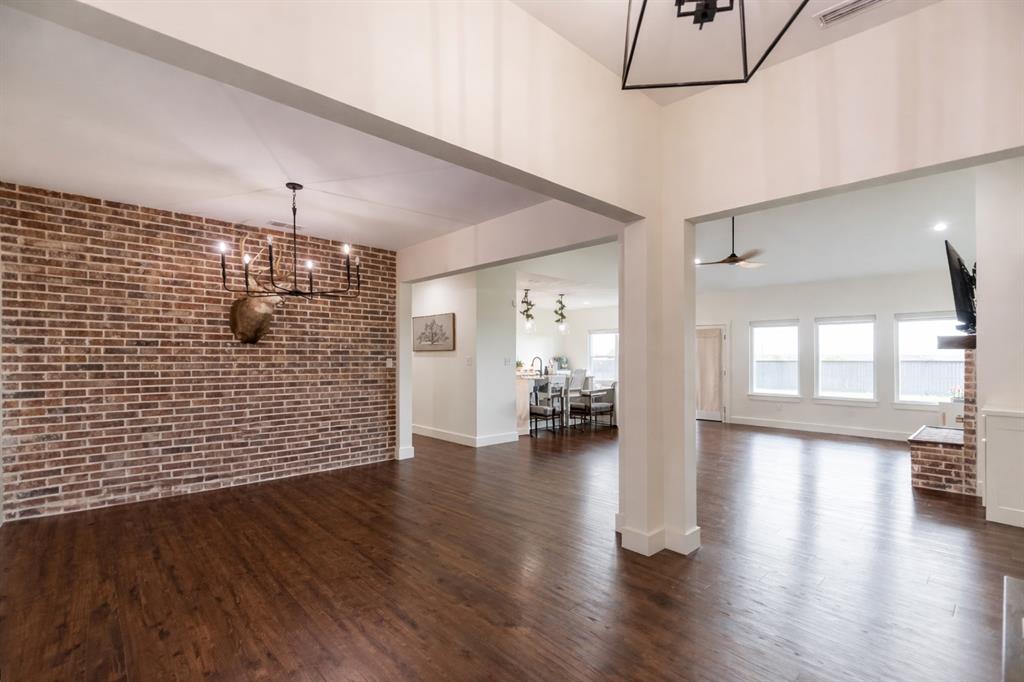 143 Purcell Lane Tuscola, TX 79562 - Photo 7 of 35 a view of livingroom with hardwood floor and a ceiling fan