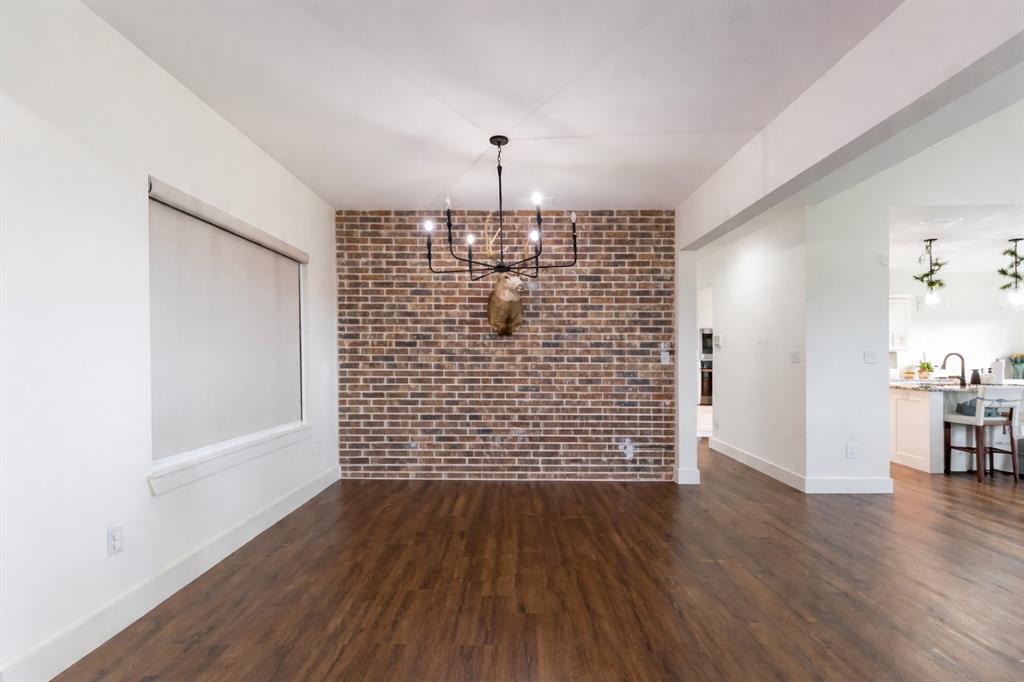 143 Purcell Lane Tuscola, TX 79562 - Photo 8 of 35 wooden floor in an empty room with a window