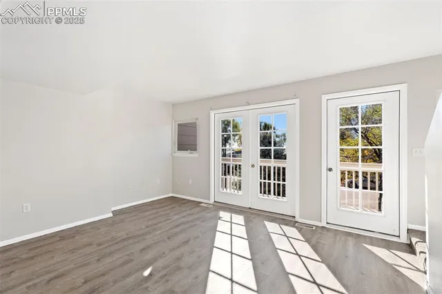 a view of a balcony with wooden fence and floor
