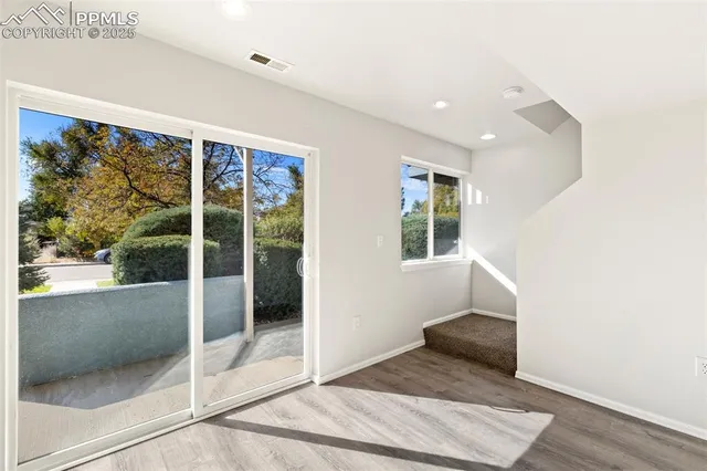 a kitchen with stainless steel appliances granite countertop a sink and a stove