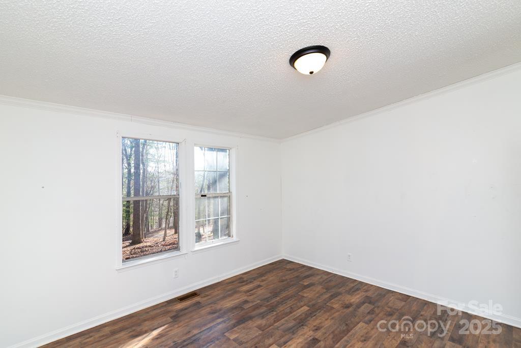 7368 Martins Creek Road Murphy, NC 28906 - Photo 12 of 21 a view of an empty room with wooden floor and a window