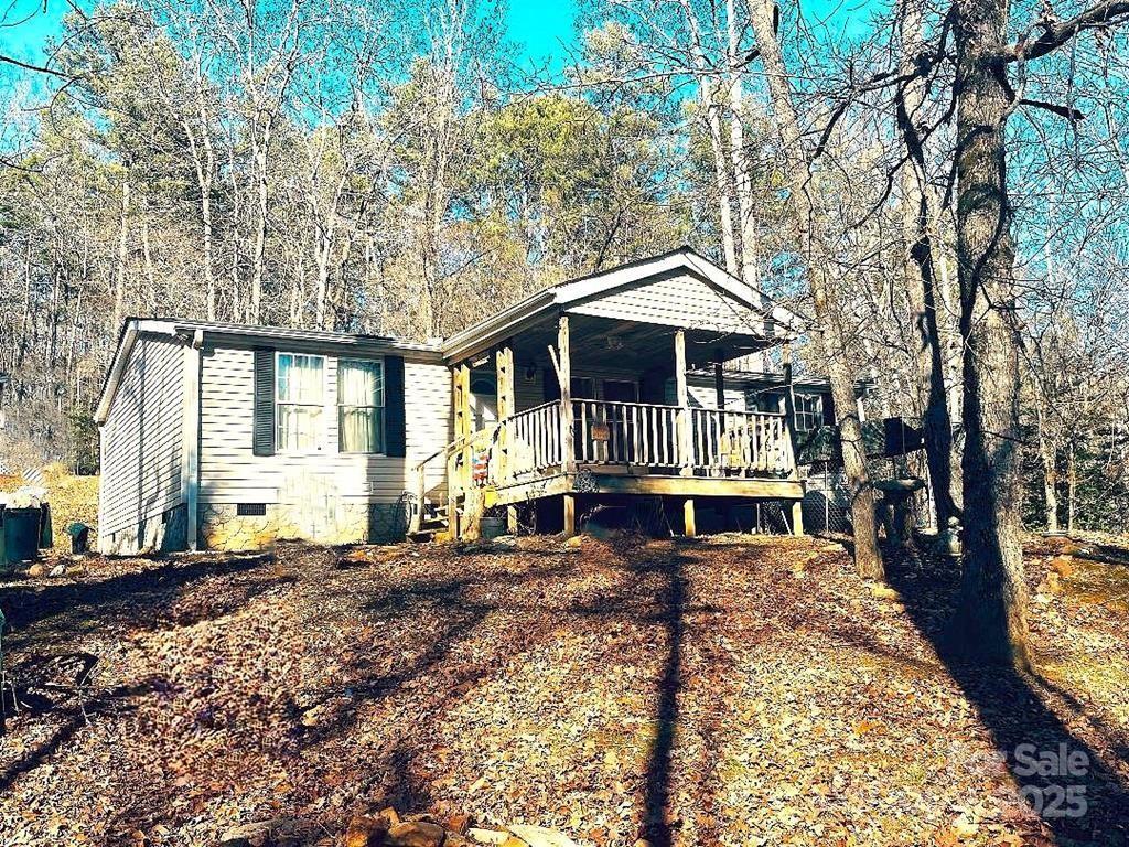 7368 Martins Creek Road Murphy, NC 28906 - Photo 4 of 21 a view of a house with large trees and a yard