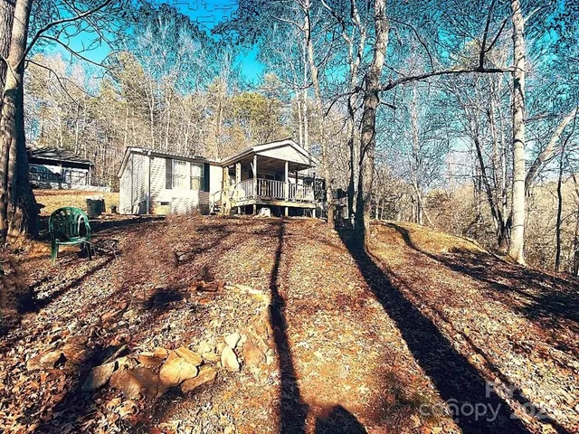 a view of a kitchen with wooden floor and a sink