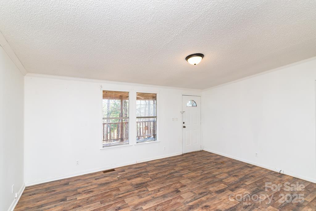 7368 Martins Creek Road Murphy, NC 28906 - Photo 8 of 21 a view of empty room with wooden floor and fan