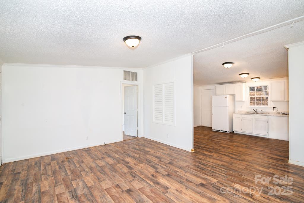 7368 Martins Creek Road Murphy, NC 28906 - Photo 9 of 21 a view of a kitchen with wooden floor and a sink